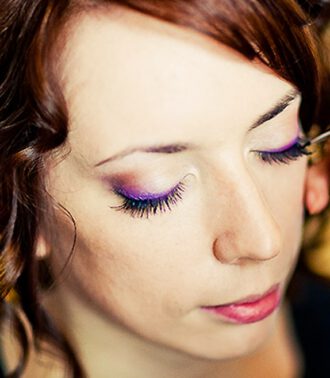 Woman receiving makeup application, Viasun cosmetics theme
