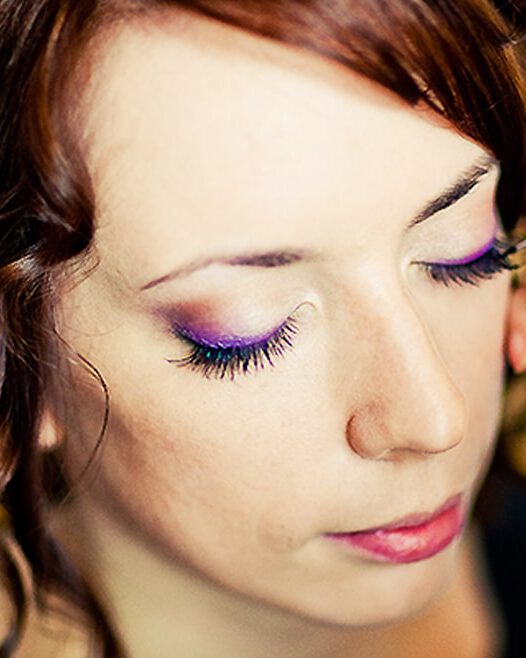 Woman receiving makeup application, Viasun cosmetics theme