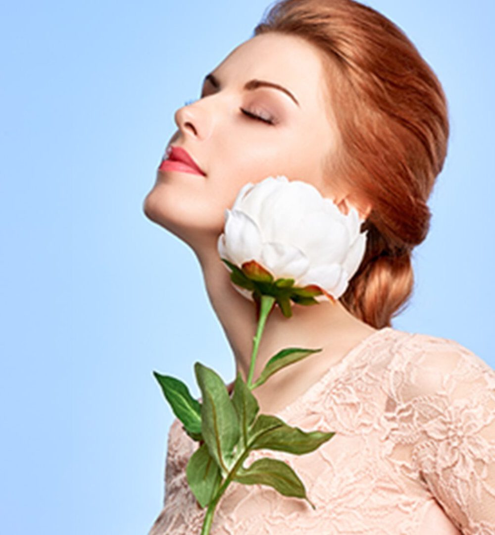Viasun cosmetics theme with serene woman and white flower